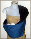 Newborn baby in a front carrier