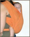 Newborn baby in a front carrier