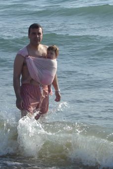 Dad and baby at the sea!" title="Dad and baby at the sea in a carrier with sunscreen!
