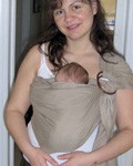 Mom with a newborn baby in a ring sling