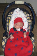 A newborn in a car seat