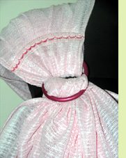 Sun-protective solarveil fabric in a sling carrier