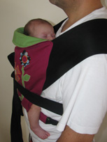 A newborn in a sling