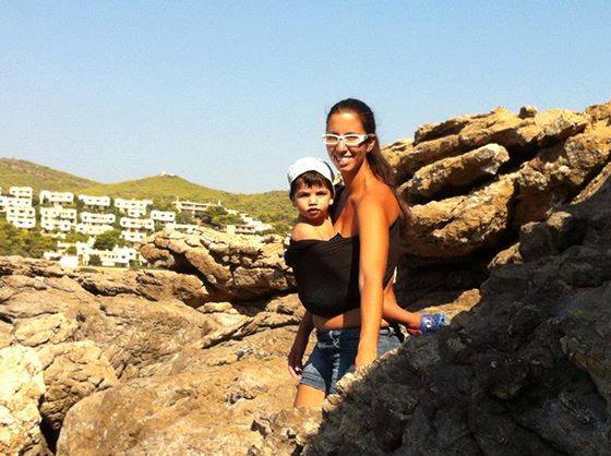 a baby in a mesh sling carrier for the sea