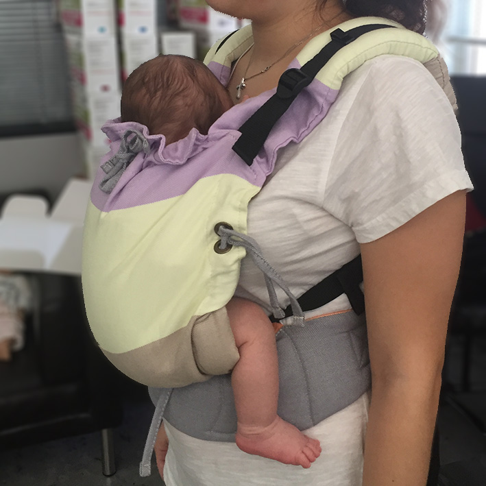 Newborn in a Luna — perfect seat & J-shape