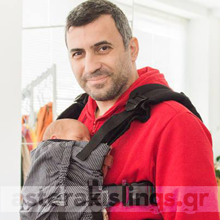 Dad with newborn sleeping in a KiBi