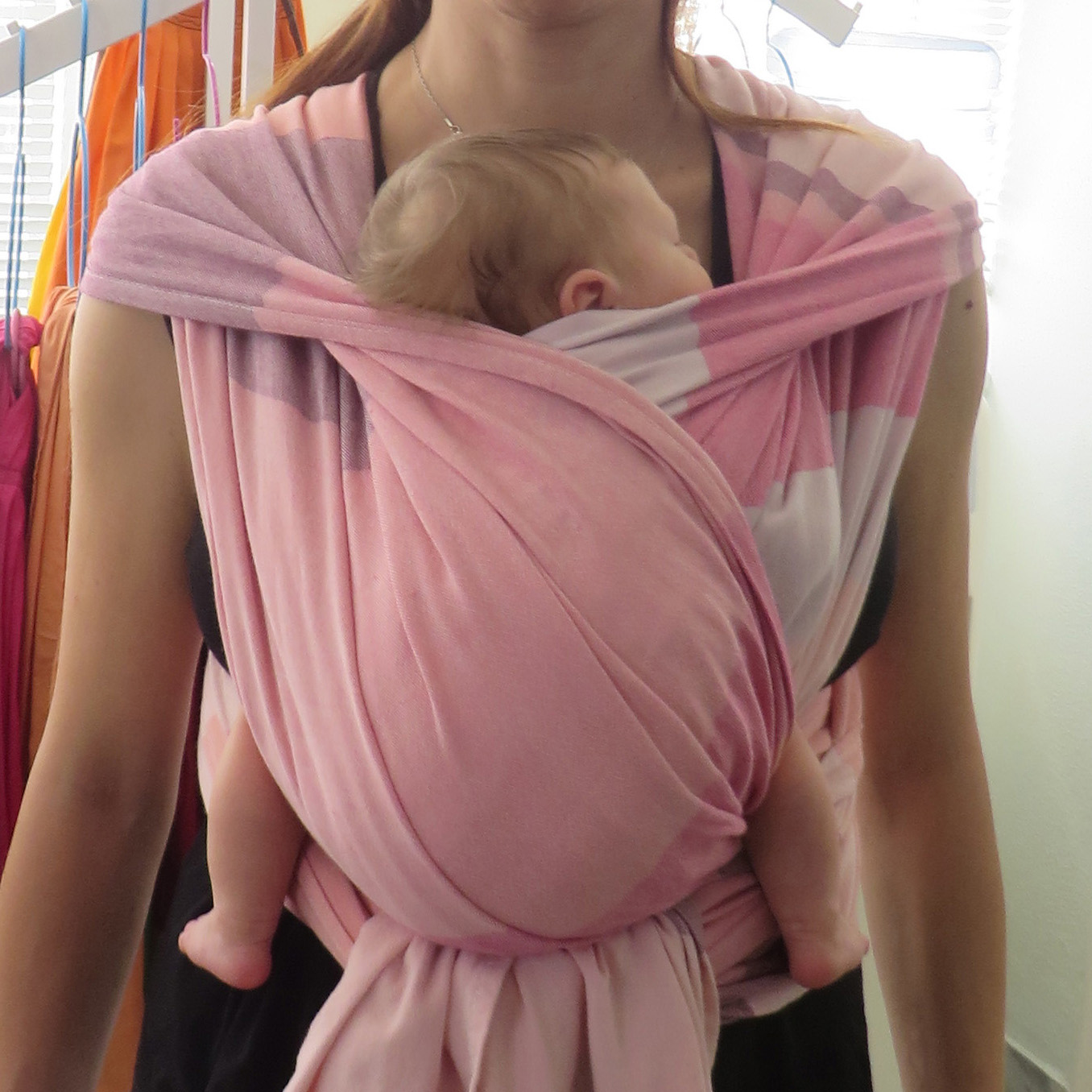 Woven wrap with a newborn