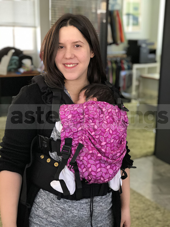 Smiling mum with newborn in a KiBi