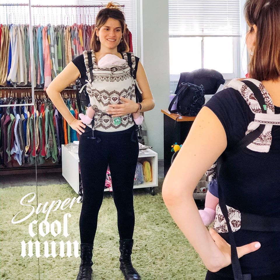Newborn in a Luna buckle carrier