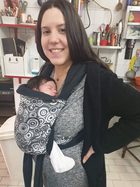 Beautiful newborn in a mei tai