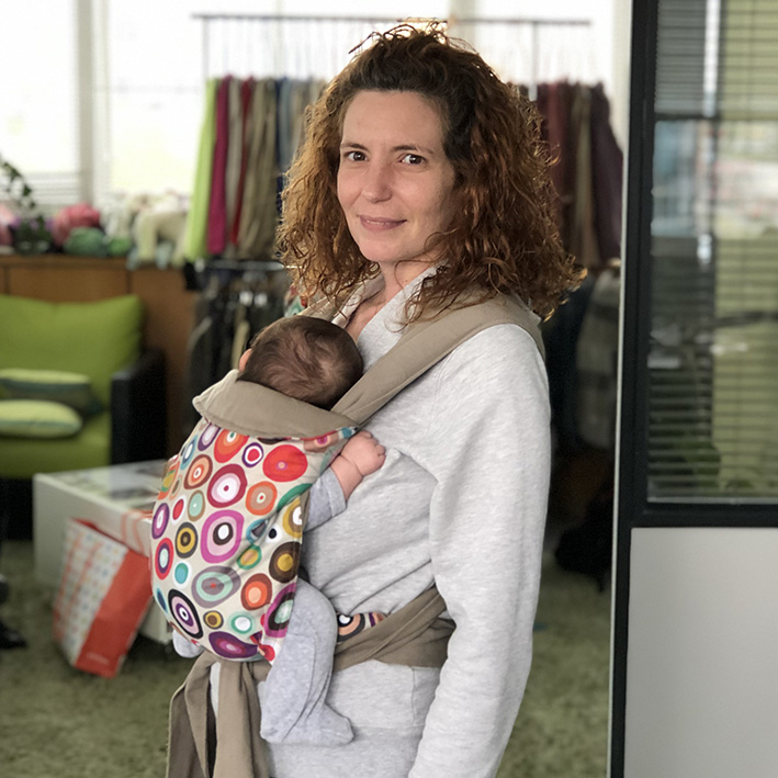 Newborn in a mei tai — J-shape position