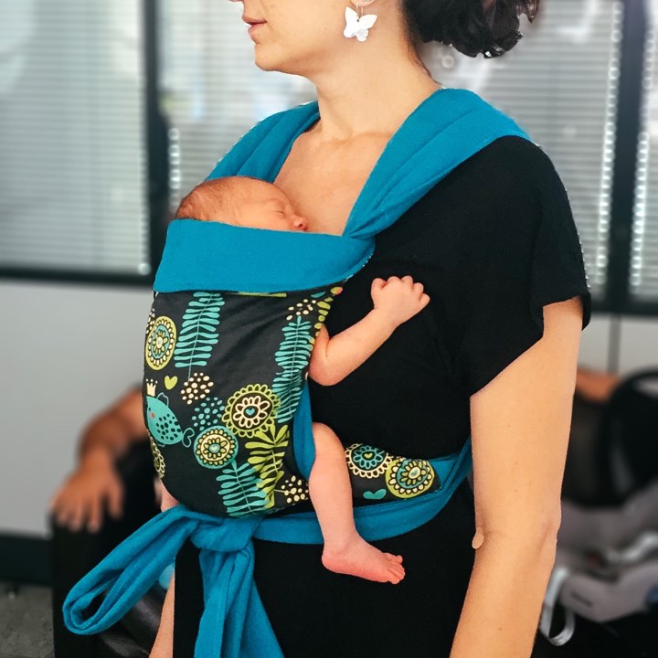Newborn sleeping in a mei tai
