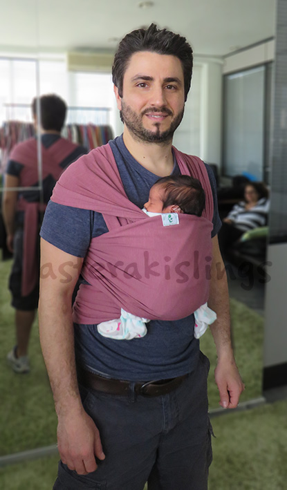 Dad with newborn in a stretchy wrap