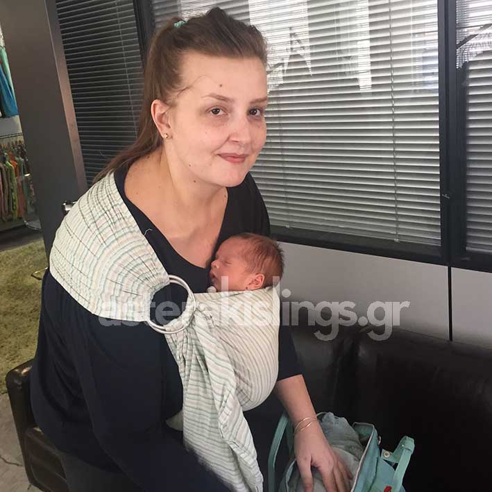 Newborn in a ring sling — hands free
