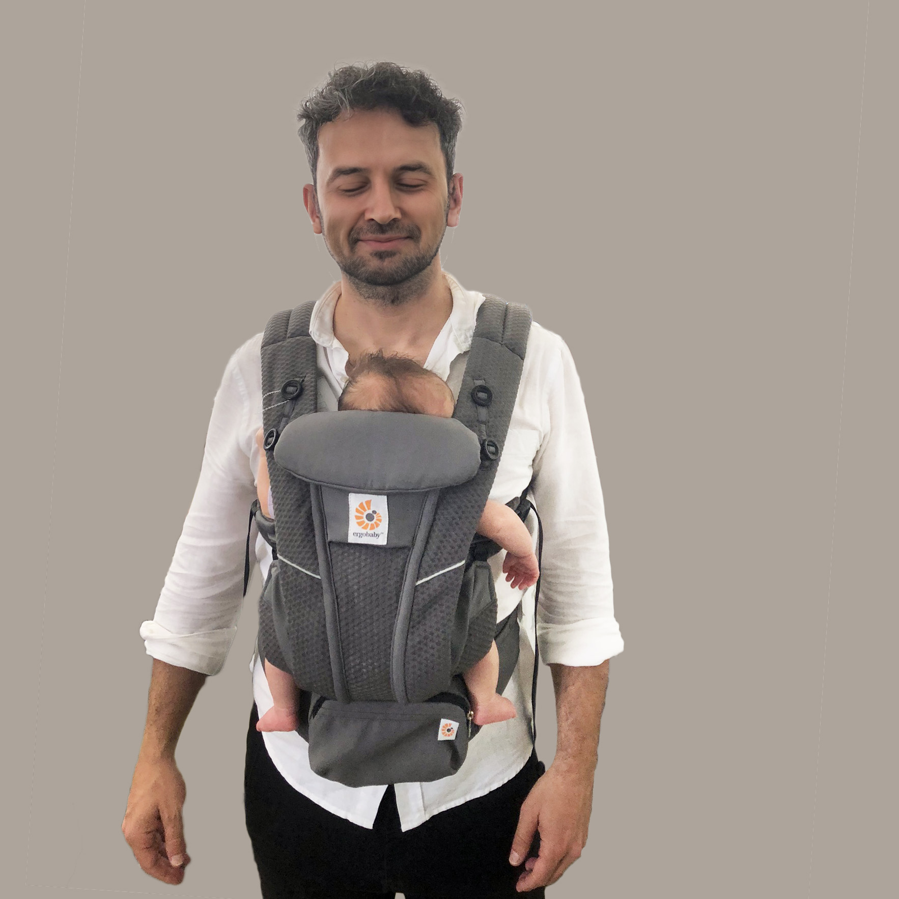 Dad with his newborn baby in an Ergobaby Omni carrier
